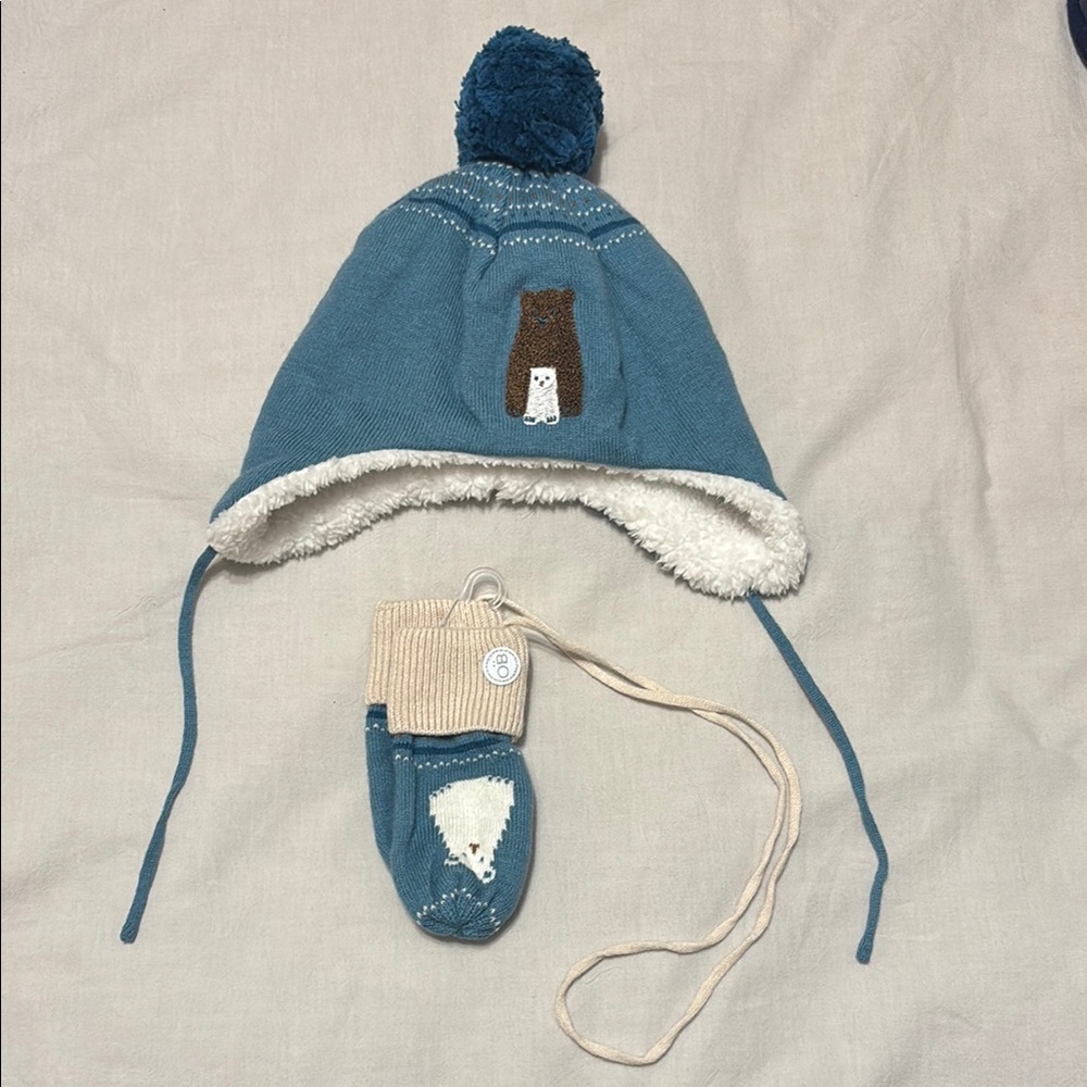 Blue Knitted Hat with Ear Flaps and Pom-Pom